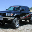 Load image into Gallery viewer, Tuff Country 95-04 Toyota Tacoma 4x4 &amp; PreRunner 5in Lift Kit (SX6000 Shocks) - Back View