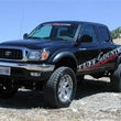 Load image into Gallery viewer, Tuff Country 95-04 Toyota Tacoma 4x4 &amp; PreRunner 5in Lift Kit (SX8000 Shocks) - Side View
