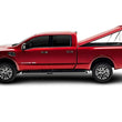 Load image into Gallery viewer, UnderCover 16-20 Nissan Titan 6.5ft SE Smooth Bed Cover - Ready To Paint - Installation View