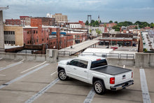 Load image into Gallery viewer, UnderCover 19-20 Ram 1500 5.7ft Ultra Flex Bed Cover - Matte Black Finish - Installation View