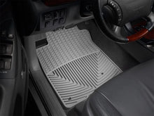 Load image into Gallery viewer, WeatherTech 00-05 Hyundai Accent Front Rubber Mats - Grey - Installation View