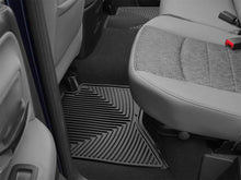 Load image into Gallery viewer, WeatherTech 02-14 Dodge Ram Quad Cab Rear Rubber Mats - Black - Installation View