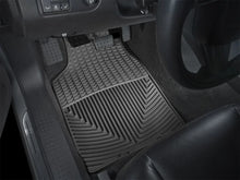 Load image into Gallery viewer, WeatherTech 03-10 Cadillac CTS Front Rubber Mats - Black - Installation View