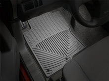 Load image into Gallery viewer, WeatherTech 08+ Nissan Xterra Front Rubber Mats - Grey - Installation View