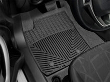 Load image into Gallery viewer, WeatherTech 11+ Ford Fiesta Front Rubber Mats - Black - Installation View