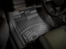 Load image into Gallery viewer, WeatherTech 11+ Toyota FJ Cruiser Front FloorLiner - Black - Installation View