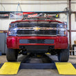 Load image into Gallery viewer, Wehrli 15-19 Chevrolet 2500/3500 Front Bumper Valance Filler Panel Kit w/Tow Hooks - Texture Black - Side View
