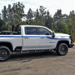Load image into Gallery viewer, Westin 2020 Chevy Silverado 2500/3500 Crew Cab (6.5ft Bed) HDX W2W Nerf Step Bars - Textured Black - Back View