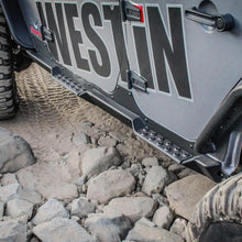 Load image into Gallery viewer, Westin/Snyper 07-17 Jeep Wrangler Unlimited Rock Slider Steps - Textured Black - Installation View
