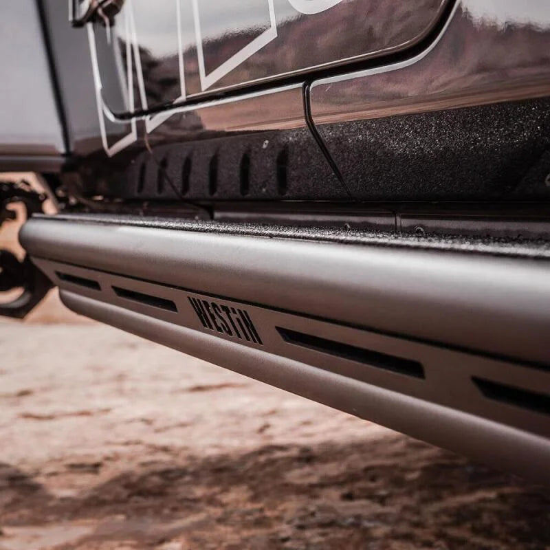 Westin/Snyper 2018+ Jeep Wrangler JL Unlimited 4DR Triple Tube Rock Rail Steps - Textured Black - Installation View