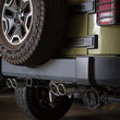 Load image into Gallery viewer, aFe Rebel Series 2.5in 409 SS Axle-Back Exhaust Polished 07-18 Jeep Wrangler (JK) V6-3.6L/3.8L - Installation View