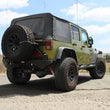 Load image into Gallery viewer, aFe Rebel Series Cat-Back 2.5in Dual Center Exit SS Exhaust w/ Black Tips 07-14 Jeep Wrangler V6 - Side View