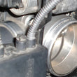 Load image into Gallery viewer, aFe Silver Bullet Throttle Body Spacers TBS BMW 325i (E46) 01-06 L6-2.5L - Side View