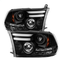 Load image into Gallery viewer, Spyder Auto (Spyder Signature) Projector Headlights - Light Bar DRL - Black 5080912 fits 2013-2018 Ram 1500 / 2013-2016 Ram 2500 / 2013-2016 Ram 3500