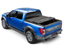 Load image into Gallery viewer, Extang 16-23 Nissan Titan XD w/o Rail Sys. (6ft. 7in. Bed) Solid Fold ALX